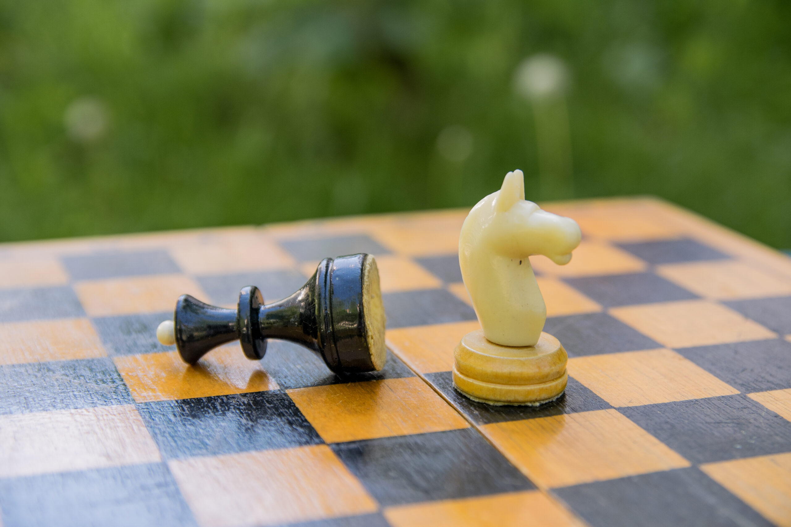 Strategic chess move with knight capturing queen, symbolizing decisive competitive advantage"